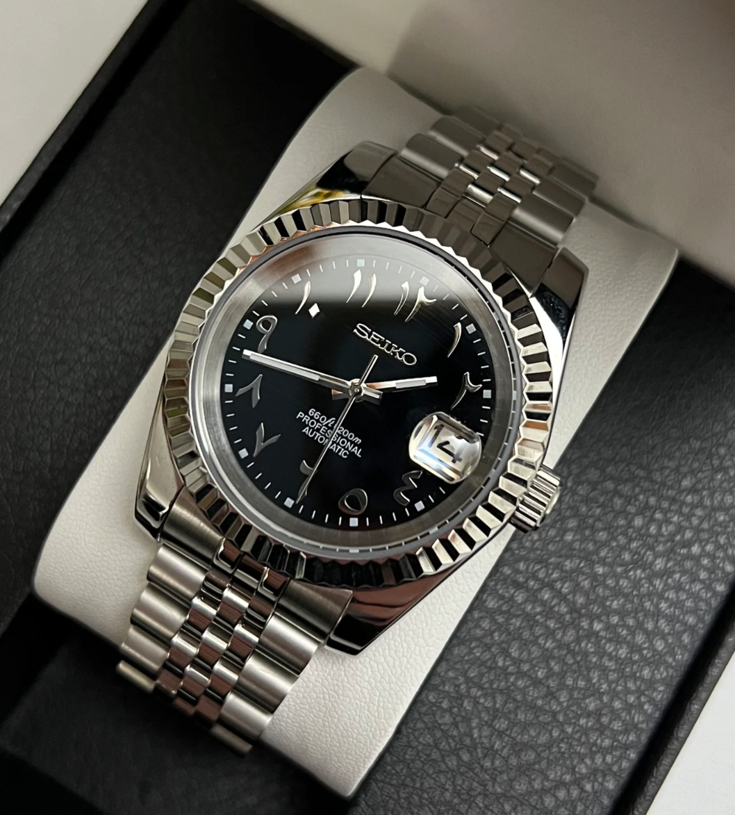 Close up front view of Seiko Mod Datejust Black Arabic with silver bezel and jubilee bracelet