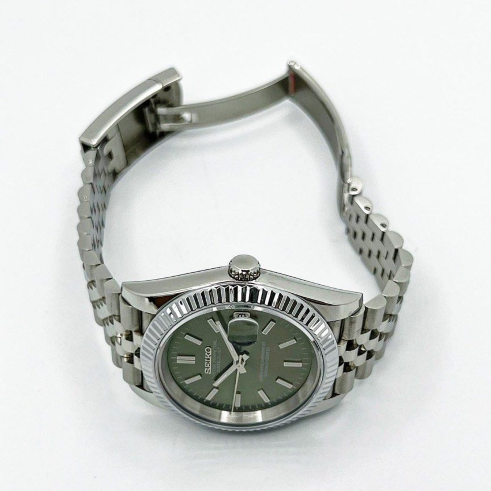 Seiko Moddys Datejust Mint Green Dial watch displayed open on bracelet top view with polished links