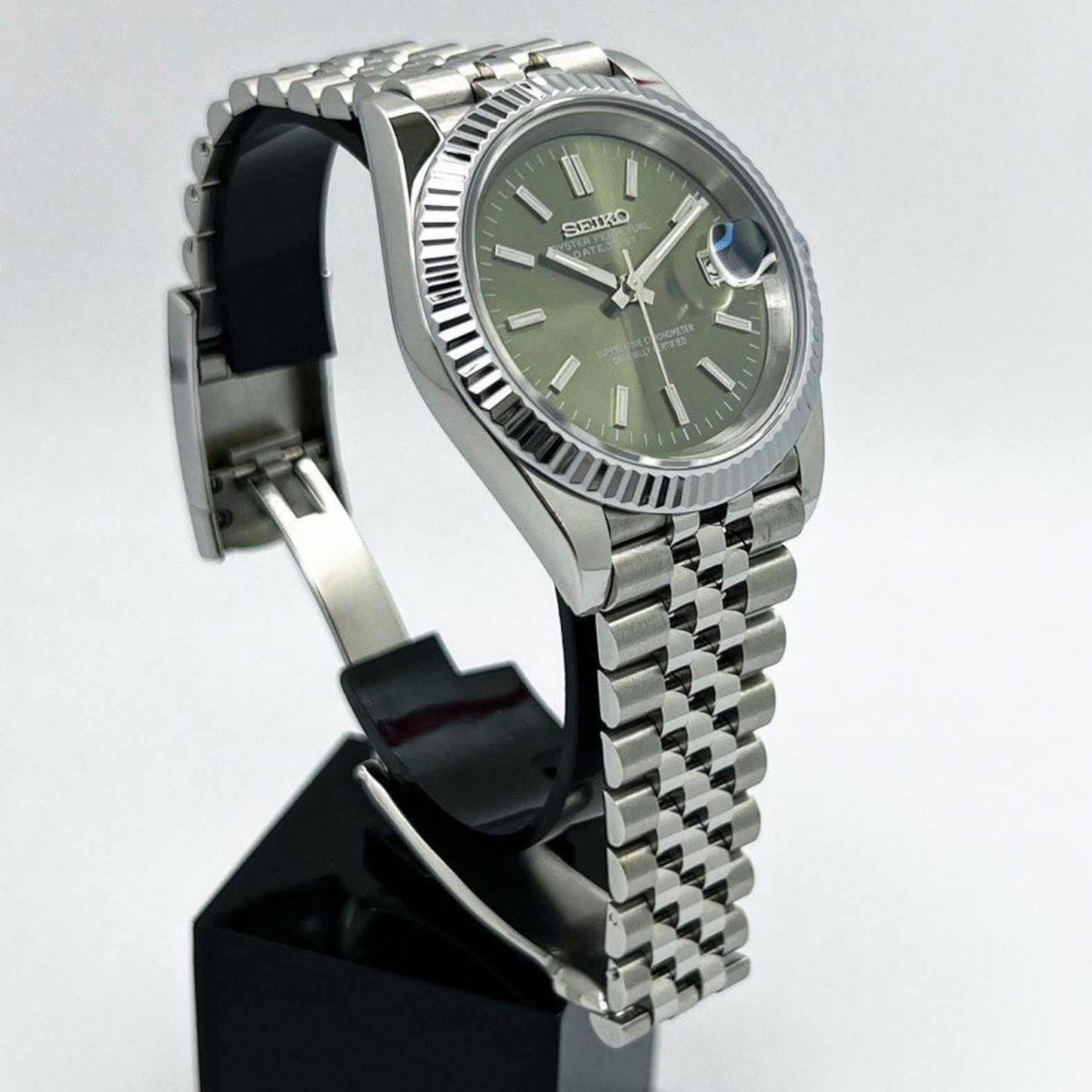 Left-angled perspective of Seiko Moddys Datejust Mint Green Dial watch showing detailed case and bezel