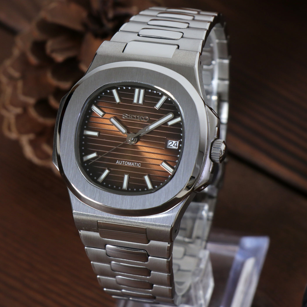 Right angled view of Seiko mod Nautilus brown emphasizing rich brown dial and steel bracelet