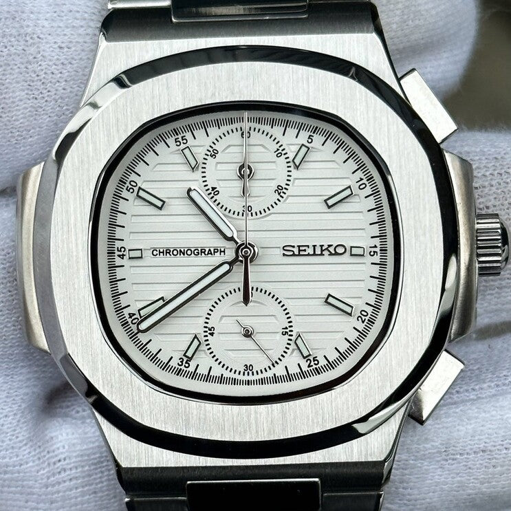 Front view of Seiko mod Nautilus chronograph white dial with vertical subdials and brushed bezel