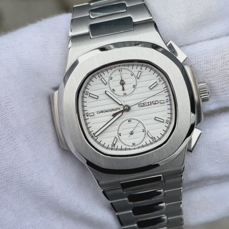 Top angled view of Seiko mod Nautilus chronograph white emphasizing polished case and bracelet