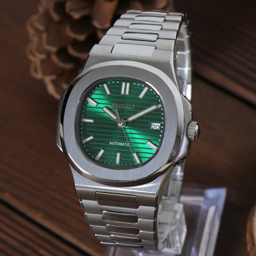 Right angled view of Seiko mod Nautilus green metallic highlighting polished bezel and green sunburst dial