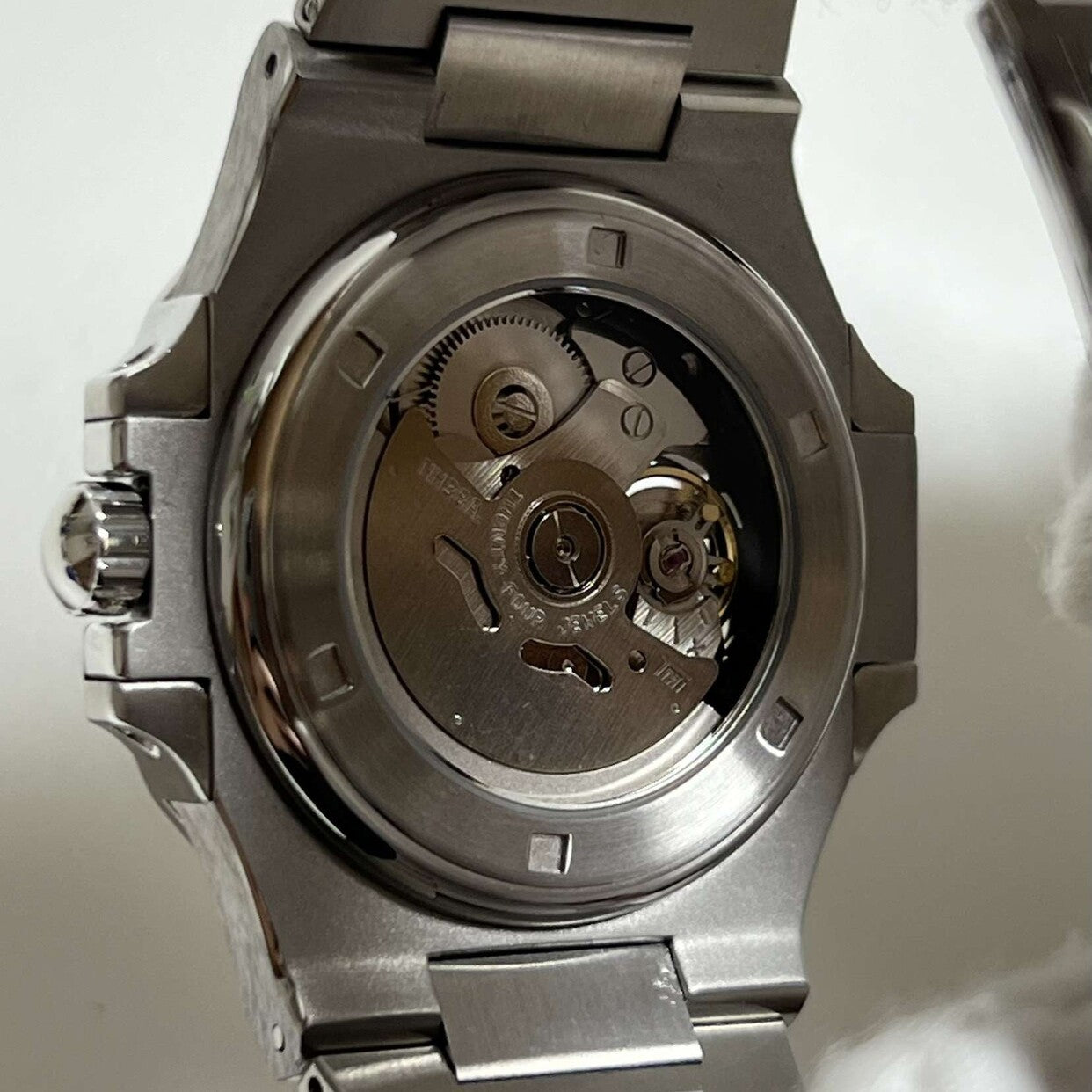 Back view Seiko Mod Nautilus Minimalist showing NH70 movement through crystal case back