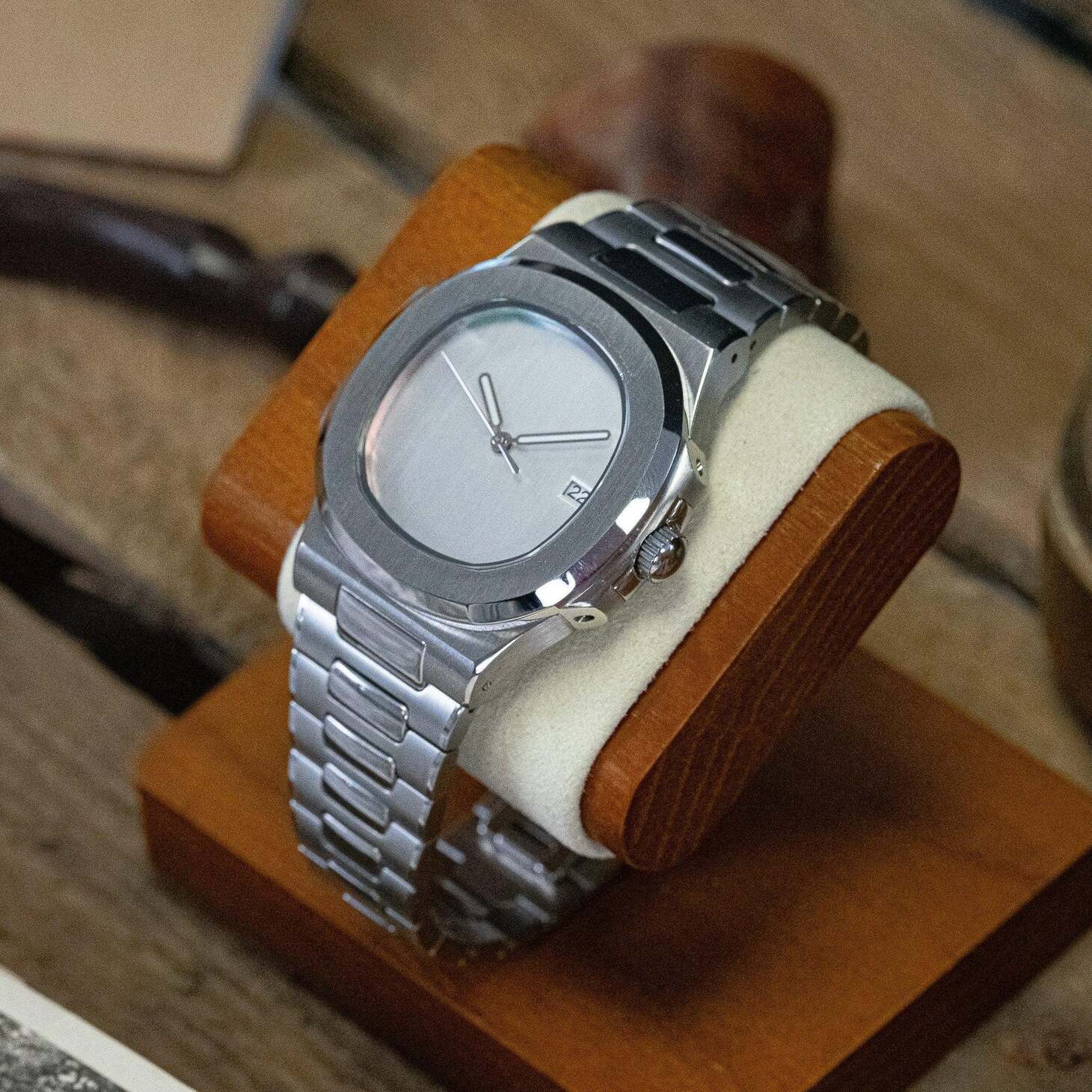 Right angled view of Seiko mod Nautilus minimalist capturing brushed bezel and smooth dial symmetry