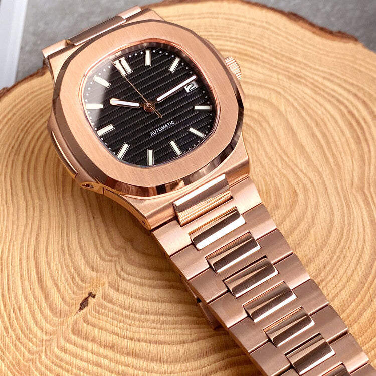Top view of Seiko mod Nautilus rose gold black edition displayed on wood surface emphasizing dial texture and bracelet integration