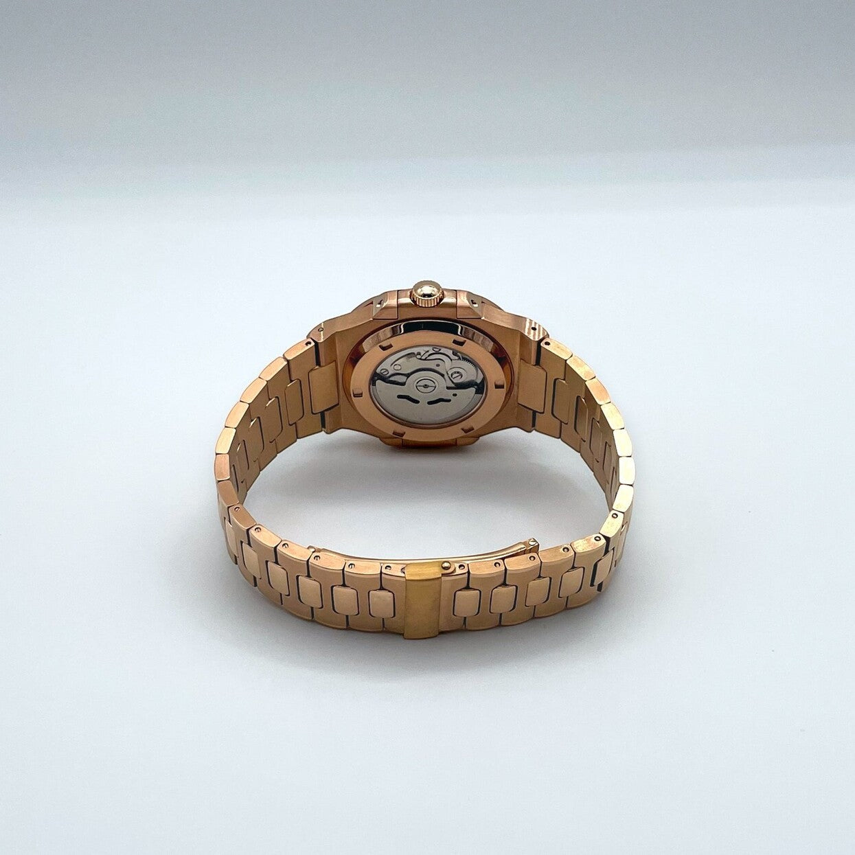 Back view of Seiko mod Nautilus rose gold royal blue edition showing transparent case back and automatic rotor