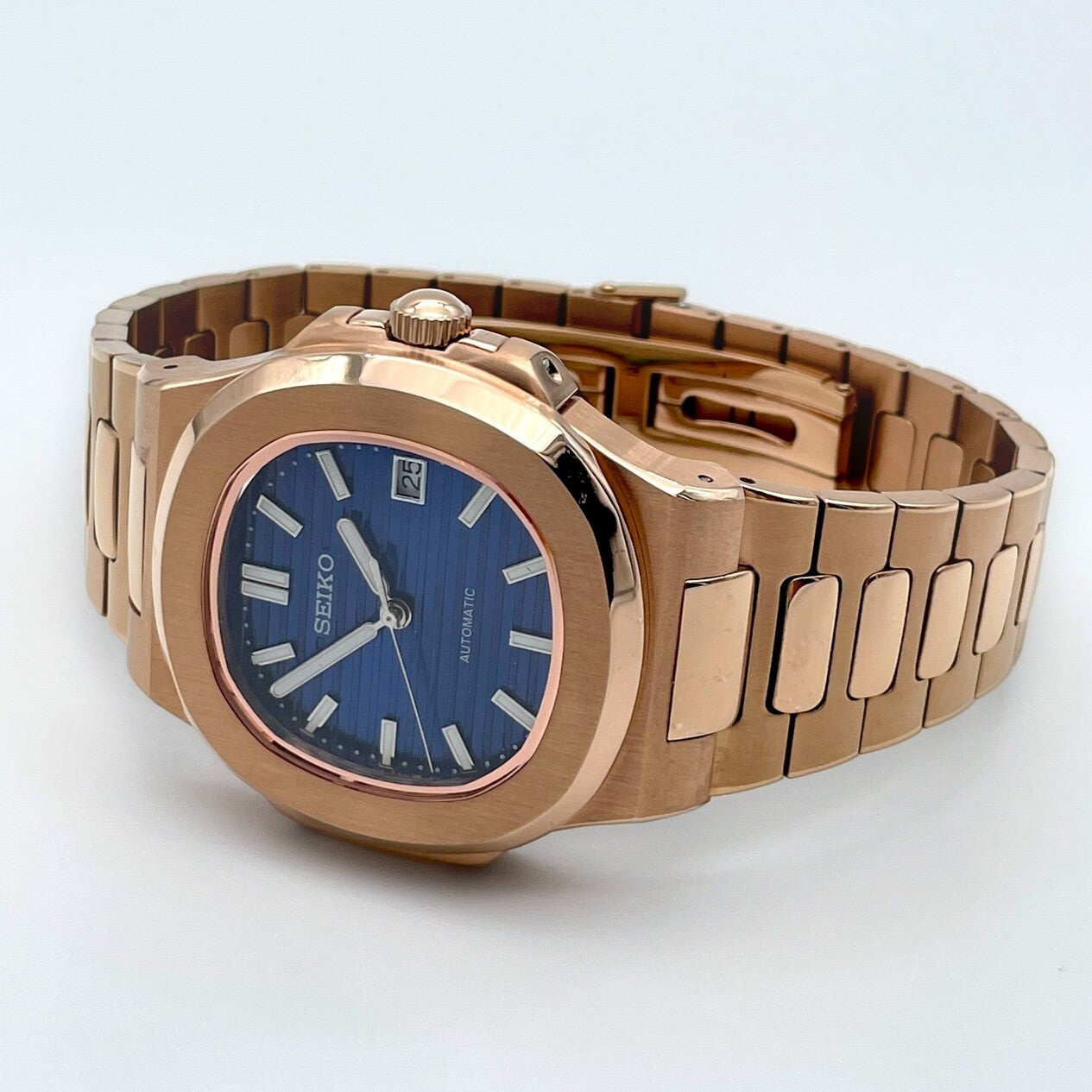 Side crown view of Seiko mod Nautilus rose gold royal blue edition highlighting curved case geometry