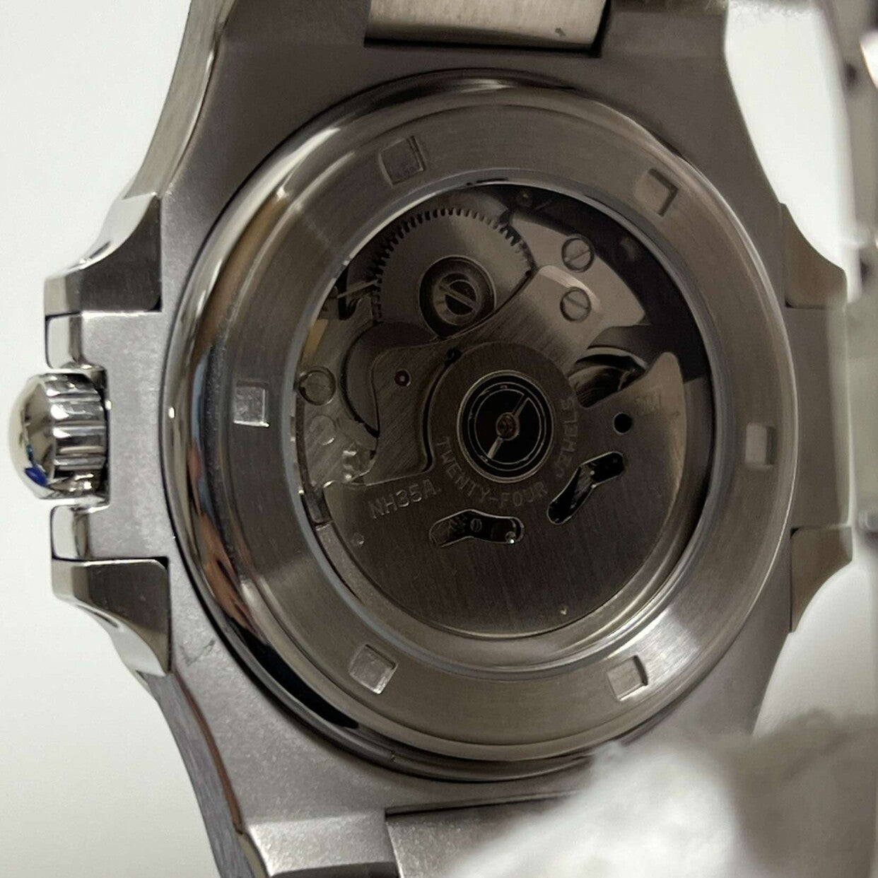 Close up of Seiko mod Nautilus royal blue edition transparent case back showcasing NH35 automatic movement