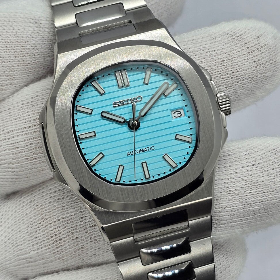 Hand view Seiko Mod Nautilus Tiffany displaying wrist angle and metallic reflections
