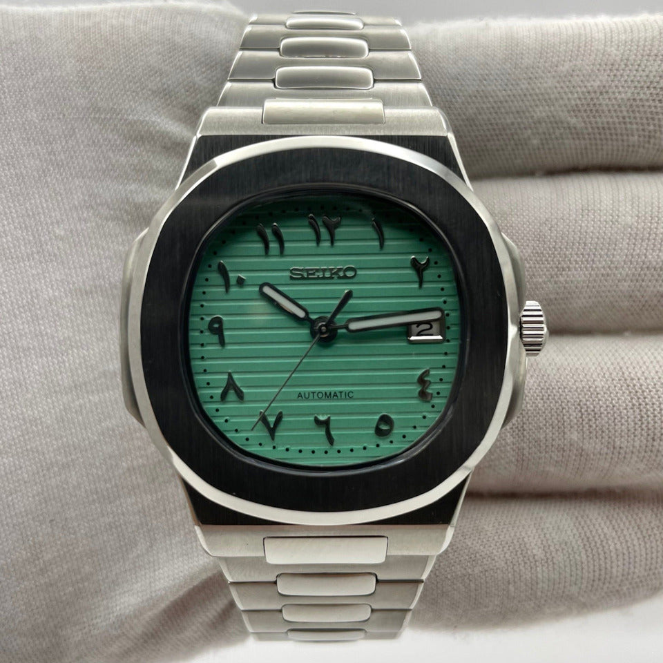 Front view Seiko Mod Nautilus Tiffany Arabic with mint dial and stainless bracelet visible