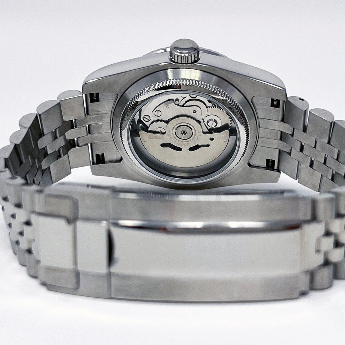 Seiko Mod Ice Blue Roman case back showing automatic movement and steel bracelet