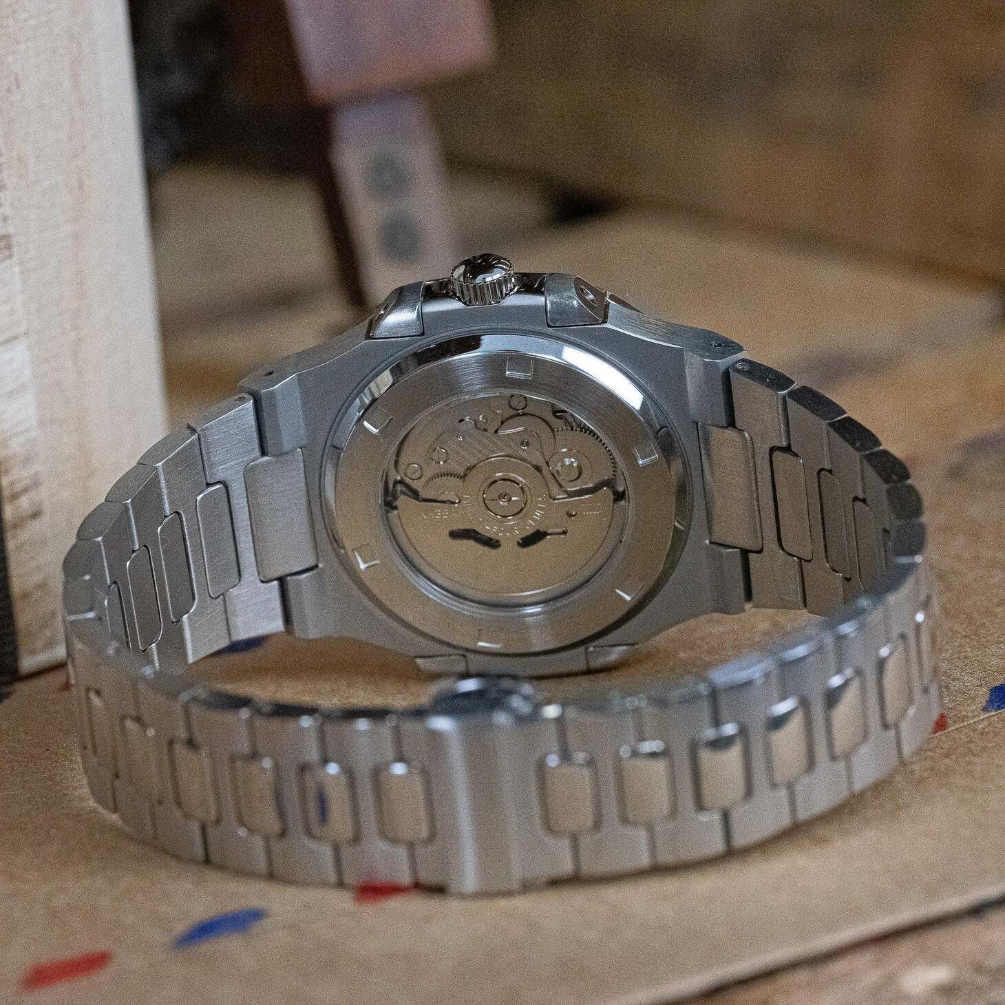 Transparent case back of Seiko mod Nautilus black Arabic showing NH35 movement details