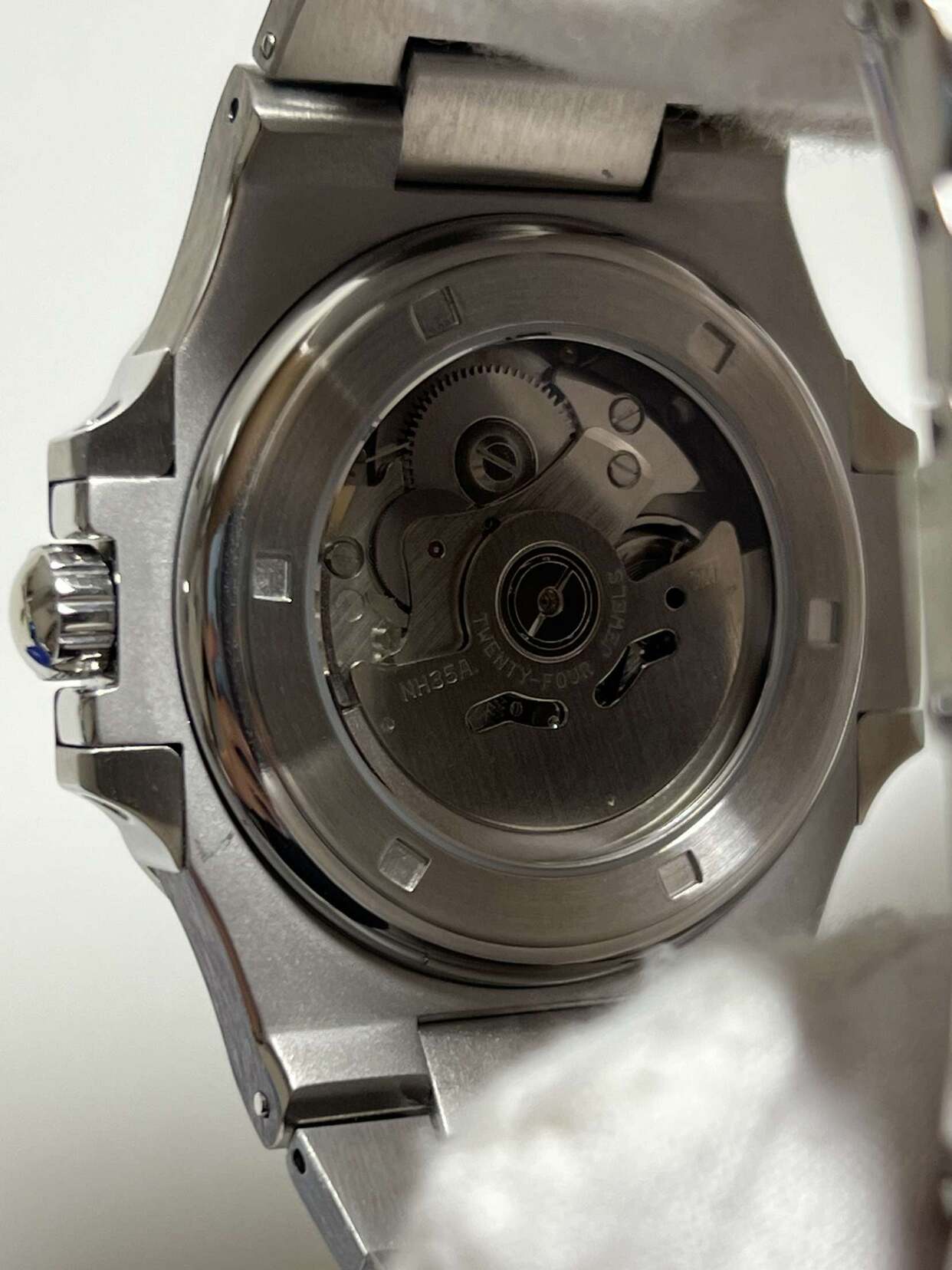 Close up on Seiko mod Nautilus black movement through sapphire case back