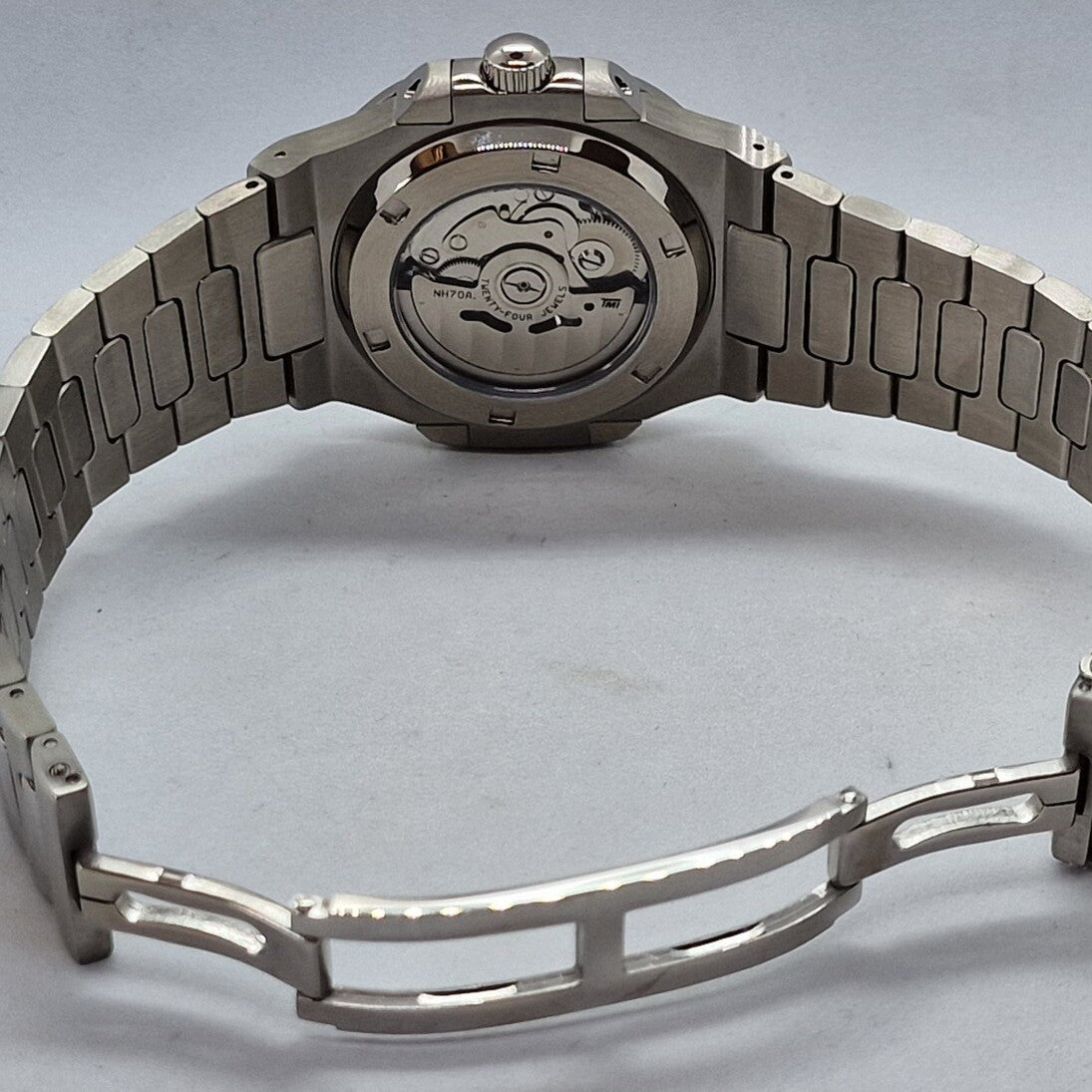 Rear view Seiko Mod Nautilus Skeleton with open clasp and NH70 movement visible through case back