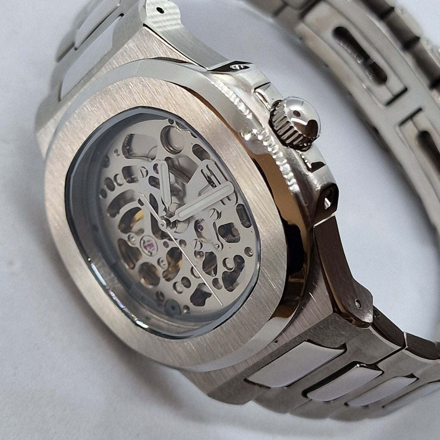 Right angled front view of Seiko Mod Nautilus Skeleton showing crown design and mechanical depth